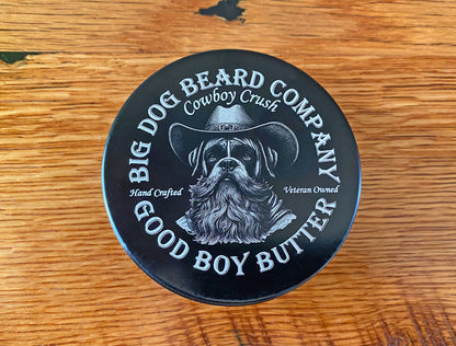 Close-up of Cowboy Crush Good Boy Beard Butter, blending rich cedarwood, oakmoss, black pepper, and coffee scents in a premium tin.