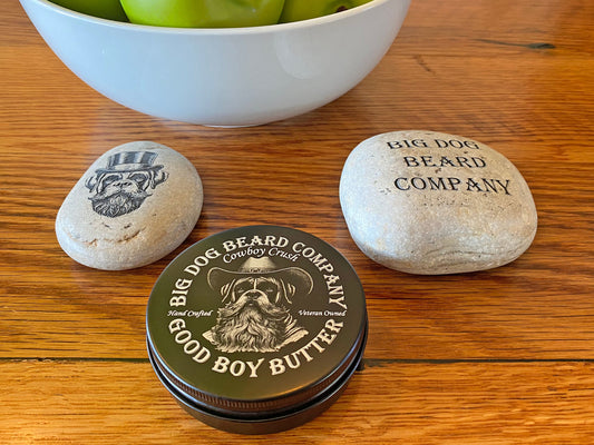 A tin of Cowboy Crush Good Boy Beard Butter by Big Dog Beard Company, featuring a rugged yet refined design inspired by the spirit of the Old West.