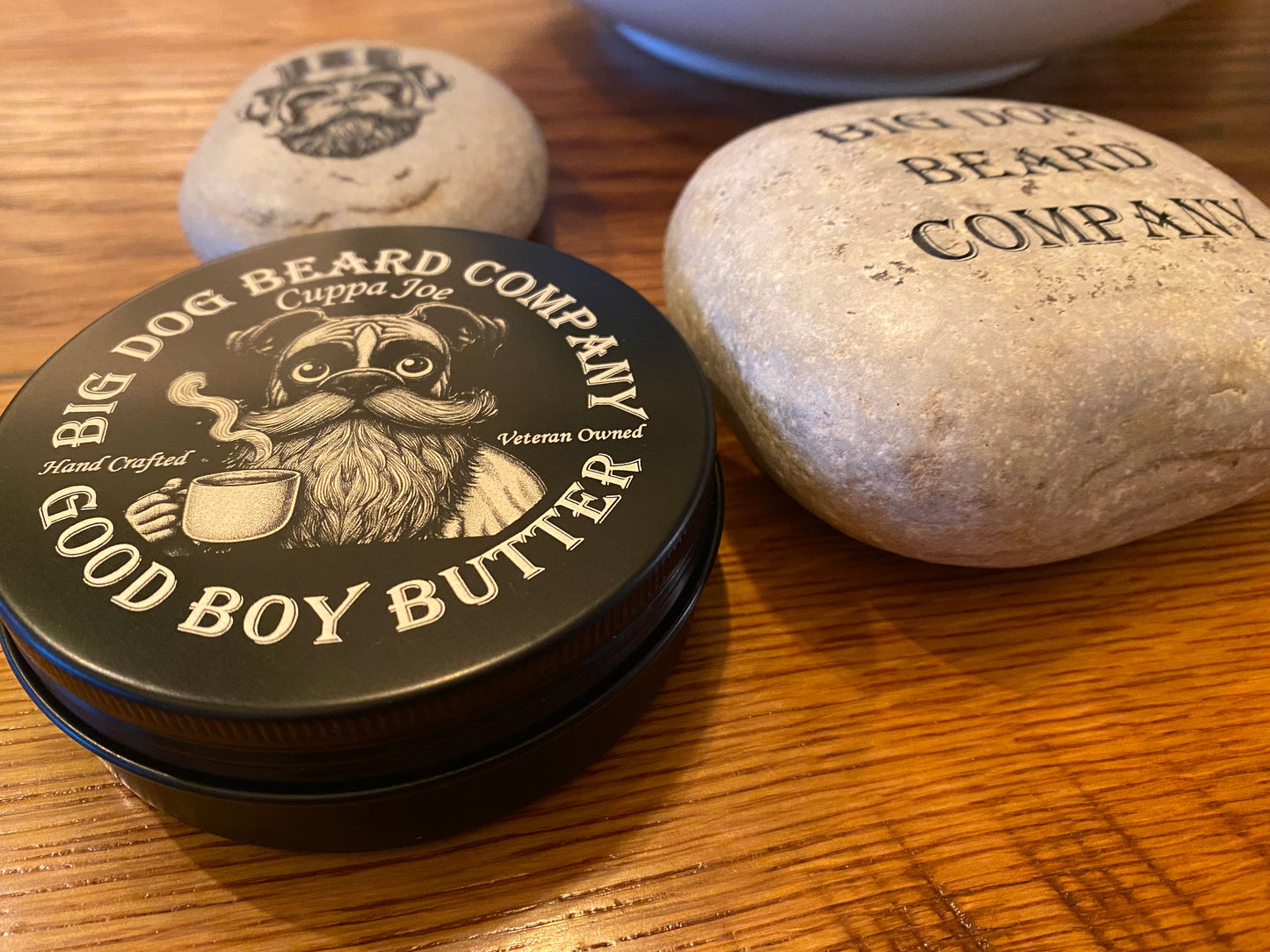 A tin of Cuppa Joe GOOD BOY Beard Butter by Big Dog Beard Company, closeup on table