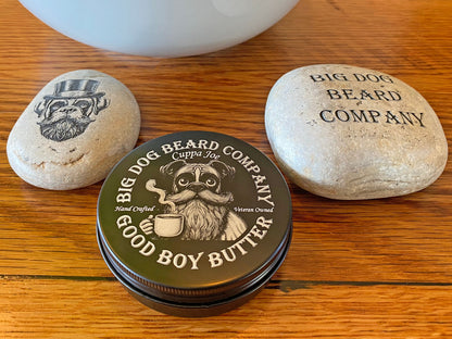 A tin of Cuppa Joe GOOD BOY Beard Butter by Big Dog Beard Company, closeup on table, top view