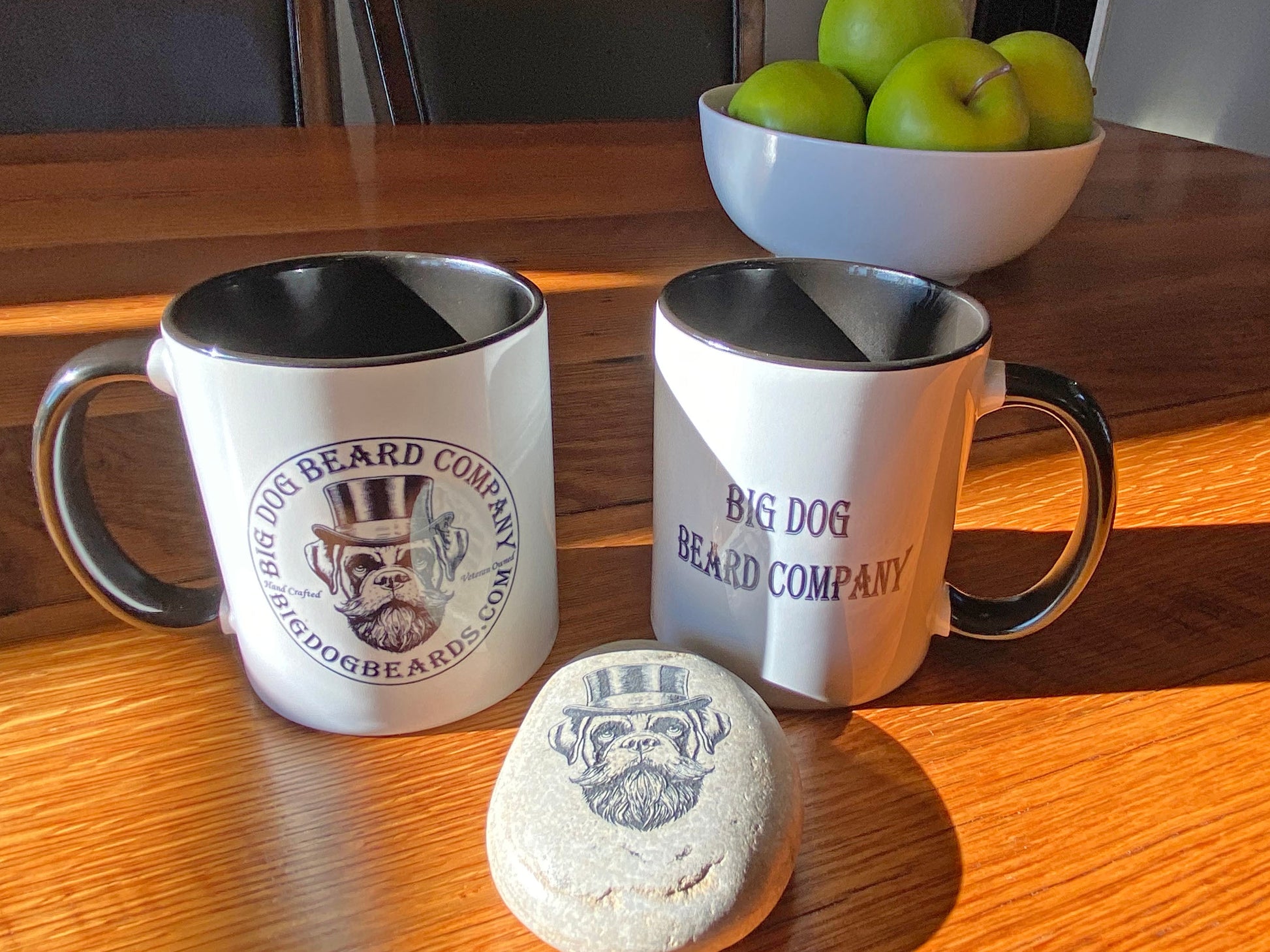 GOOD BOY Logo Coffee Mugs by Big Dog Beard Company on a sunlit tabletop