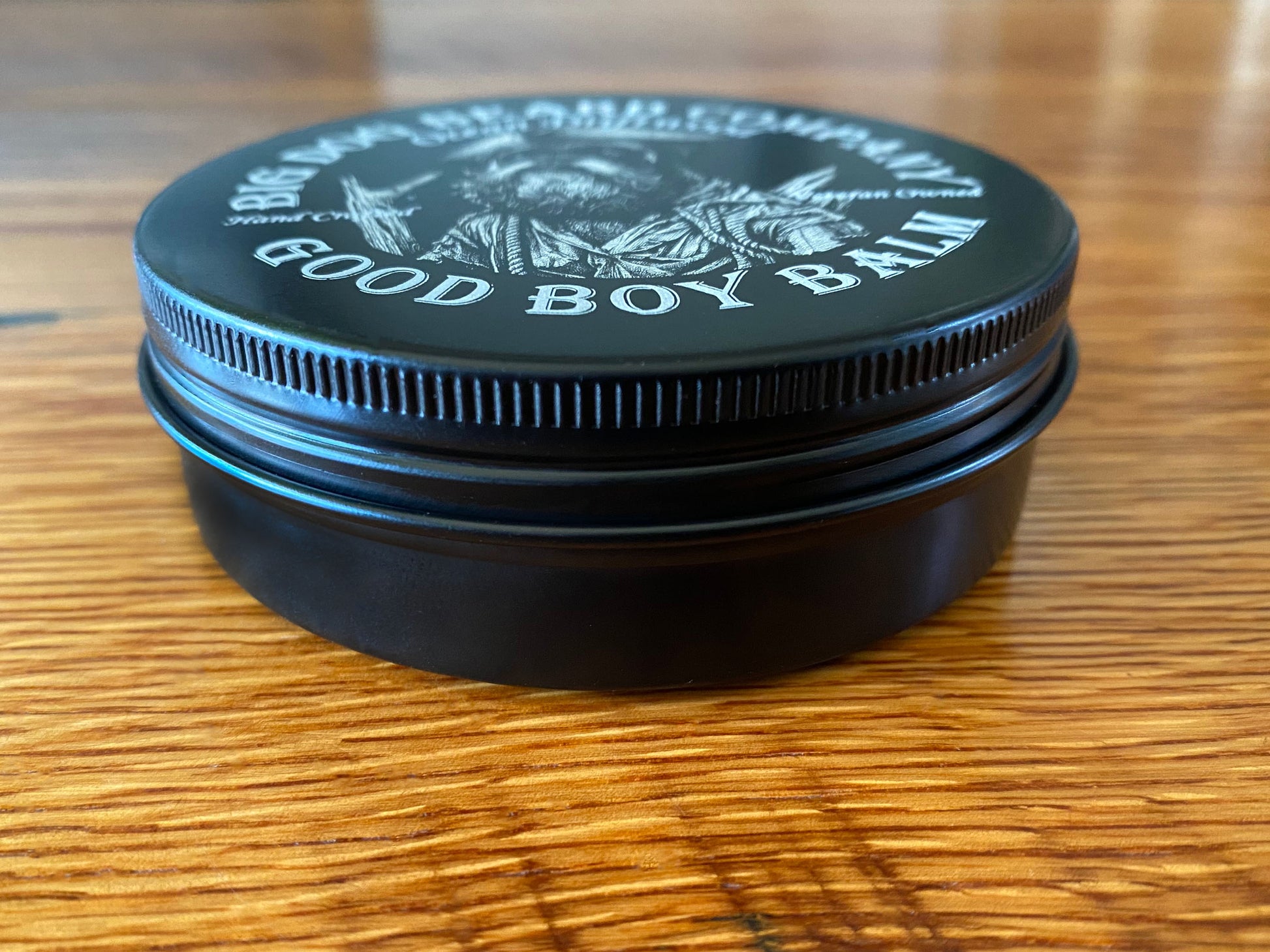 Handcrafted Ocean Driftwood GOOD BOY Beard Balm by Big Dog Beard Company, presented in premium, aluminum tins. Side iew