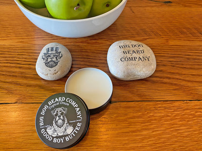 Handcrafted Tropical Dream Good Boy Beard Butter by Big Dog Beard Company, presented in a ruggedly elegant tin with scents of coconut, mango, apple and white musk with open lid.